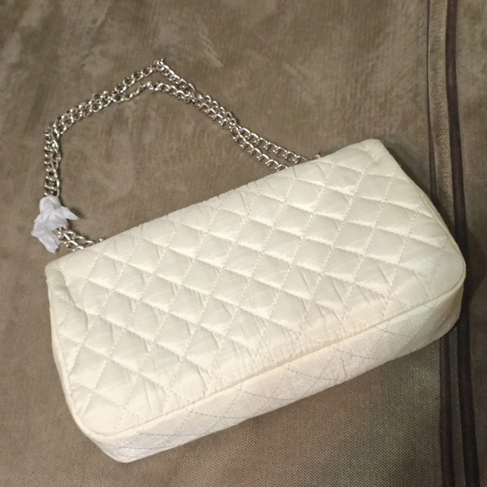 Newport news quilted chained clutch shoulder bag new never used off white.